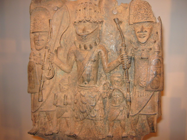 The Oba, two military soldiers and two young bearers